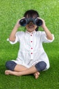 Asian Chinese little girl looking through binoculars Royalty Free Stock Photo