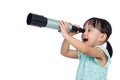 Asian Chinese little girl looking through a telescope Royalty Free Stock Photo