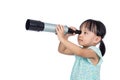 Asian Chinese little girl looking through a telescope Royalty Free Stock Photo