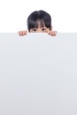 Asian Chinese little girl peeping behind white board