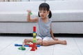 Asian Chinese little girl playing blocks on the floor Royalty Free Stock Photo