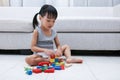 Asian Chinese little girl playing blocks on the floor Royalty Free Stock Photo