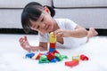 Asian Chinese little girl playing blocks on the floor Royalty Free Stock Photo