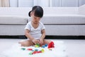 Asian Chinese little girl playing blocks on the floor Royalty Free Stock Photo