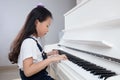 Asian Chinese little girl playing classical piano at home Royalty Free Stock Photo