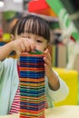 Asian Chinese little girl playing colorful magnet plastic blocks Royalty Free Stock Photo