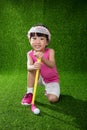 Asian Chinese little girl playing golf Royalty Free Stock Photo