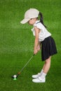 Asian Chinese little girl playing golf Royalty Free Stock Photo