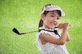 Asian Chinese little girl playing golf Royalty Free Stock Photo