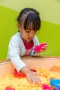 Asian Chinese Little Girl Playing Kinetic Sand