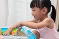 Asian Chinese little girl playing kinetic sand at home Royalty Free Stock Photo