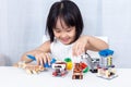 Asian Chinese little girl playing puzzle toys