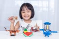 Asian Chinese little girl playing puzzle toys