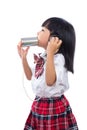 Asian Chinese little girl playing retro tin can phone Royalty Free Stock Photo