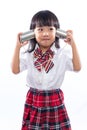 Asian Chinese little girl playing retro tin can phone