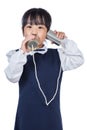 Asian Chinese little girl playing retro tin can phone