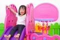 Asian Chinese little girl playing on the slide Royalty Free Stock Photo