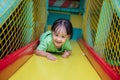 Asian Chinese little girl playing slide Royalty Free Stock Photo