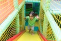 Asian Chinese little girl playing slide Royalty Free Stock Photo