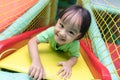 Asian Chinese little girl playing slide Royalty Free Stock Photo