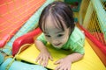 Asian Chinese little girl playing slide Royalty Free Stock Photo