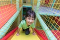 Asian Chinese little girl playing slide Royalty Free Stock Photo