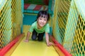 Asian Chinese little girl playing slide Royalty Free Stock Photo