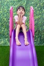 Asian Chinese Little Girl Playing on the slide Royalty Free Stock Photo