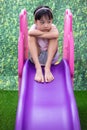 Asian Chinese Little Girl Playing on the slide Royalty Free Stock Photo