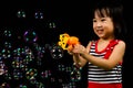 Asian Chinese Little Girl Playing Soap Bubbles Royalty Free Stock Photo