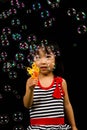 Asian Chinese Little Girl Playing Soap Bubbles Royalty Free Stock Photo