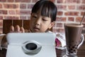 Asian Chinese little girl playing tablet computer Royalty Free Stock Photo