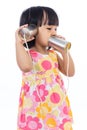 Asian Chinese little girl playing tin can phone Royalty Free Stock Photo