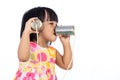 Asian Chinese little girl playing tin can phone Royalty Free Stock Photo