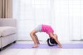 Asian Chinese little girl practicing yoga pose on a mat Royalty Free Stock Photo