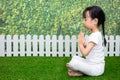 Asian Chinese little girl practicing yoga pose on a mat Royalty Free Stock Photo