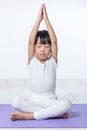 Asian Chinese little girl practicing yoga pose Royalty Free Stock Photo