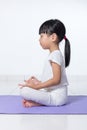 Asian Chinese little girl practicing yoga pose Royalty Free Stock Photo