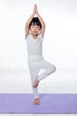 Asian Chinese little girl practicing yoga pose Royalty Free Stock Photo