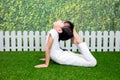 Asian Chinese little girl practicing yoga pose on a mat Royalty Free Stock Photo