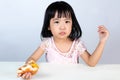 Asian Chinese little girl Refusing Eating Burger Royalty Free Stock Photo