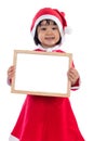 Asian Chinese little girl in santa costume holding blank message