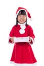 Asian Chinese little girl in santa costume holding gift box Royalty Free Stock Photo