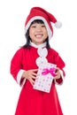 Asian Chinese little girl in santa costume holding gift box Royalty Free Stock Photo