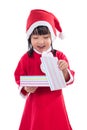 Asian Chinese little girl in santa costume holding gift box Royalty Free Stock Photo