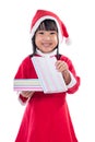 Asian Chinese little girl in santa costume holding gift box Royalty Free Stock Photo