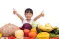 Asian Chinese little girl thumbs up with fruit and vegetable