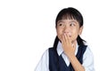 Asian Chinese little girl in uniform laughing and covering her m Royalty Free Stock Photo