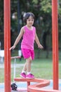 Asian Chinese little girl walking on the balance beam Royalty Free Stock Photo
