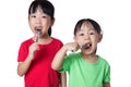 Asian Chinese little girls eating sausage